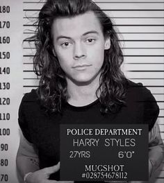 a mug shot of harry styles in front of a police mugshot sign that reads, police department harry styles