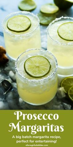 three margaritas with lime slices on the rim