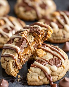 cookies with chocolate and peanut butter drizzled on top, one cookie has been cut in half