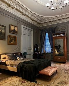 a bedroom with a large bed, dresser and mirror in it's center area