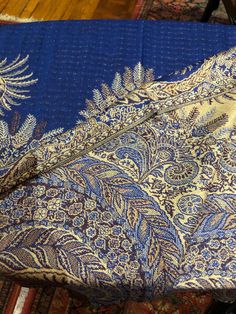 Royal Blue and beige Vintage styled wrap 28 X 70 Nice brocade paisley Very soft silk blend Styled from ancient Jamawar Indian motifs These are replicated from vintage shawl collections by my own company We may have larger quantities available for weddings, bridesmaids, or wholesale orders. Please inquire. All shipped free in the US Please check out our THOUSANDS of great reviews Gold Jamawar Shawl With Traditional Patterns, Blue Shawl With Traditional Patterns, Blue Shawl With Traditional Patterns And Drape, Elegant Blue Shawl With Paisley Print, Blue Silk Shawl Dupatta, Festive Blue Silk Shawl, Blue Silk Shawl For Festive Occasions, Blue Bohemian Shawl For Festivals, Traditional Blue Silk Shawl