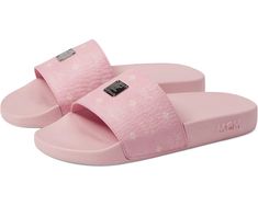 a pair of pink slippers with hearts on the bottom and one foot in the middle