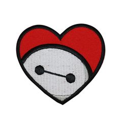 a red heart with a white face and black nose is embroidered onto the back of a patch