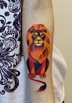 a woman with a lion tattoo on her arm