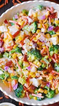 a bowl filled with corn and broccoli salad