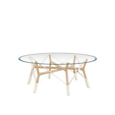 an oval glass table with wooden legs