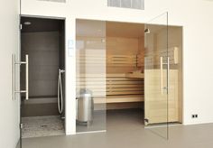 an indoor sauna is shown with glass doors