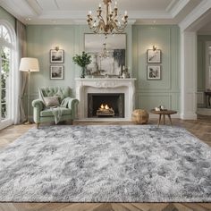 a living room filled with furniture and a fire place under a chandelier on top of a hard wood floor