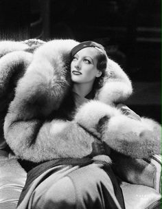 black and white photograph of woman in fur coat