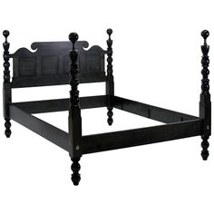 a black bed frame with wooden posts and headboard, on an isolated white background