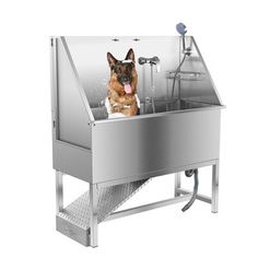 a german shepard dog sitting in a stainless steel sink