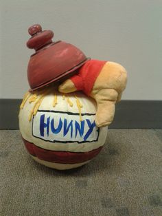 a stuffed animal sitting on top of a ball with the word knump written on it