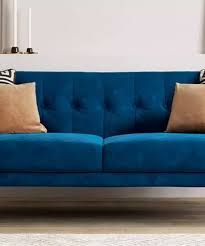 a blue couch with two pillows on it