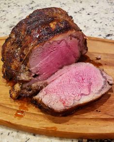 a large piece of meat sitting on top of a cutting board