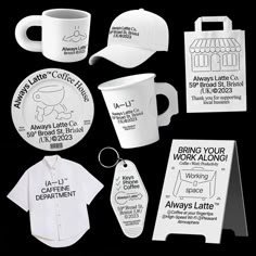 various white coffee cups and mugs with tags attached to each cup, along with other promotional items