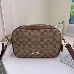 Brand : Coach Line : Signature Type : Crossbody Bag Material : Coated Canvas , Leather Color : Brown Gender : Womensize (Hxwxd) : 15.5cm X 25cm X 8.5cm / 6.1'' X 9.84'' X 3.34'' Strap Length : 107.5cm / 42.32'' Coach Crossbody Shoulder Bag, Coach Crossbody Shoulder Bag With Zipper, Coach Crossbody Shoulder Bag With Zipper Closure, Coated Canvas Crossbody Shoulder Bag, Coated Canvas Crossbody Box Bag With Detachable Strap, Crossbody Box Bag In Coated Canvas With Detachable Strap, Coach Crossbody Bag With Adjustable Strap, Coated Canvas Box Bag With Detachable Strap Crossbody, Coach Crossbody Bag In Coated Canvas