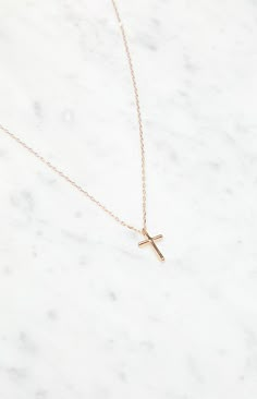 Give your look an eclectic touch with the John Galt Gold Cross Necklace, a delicate piece with a dainty chain, lobster clasp closure, and a striking gold finish, adorned with a charming cross pendant.


	Gold finish
	Dainty chain
	Cross charm
	Adjustable lobster clasp closure Cheap Gold Minimalist Cross Necklace, Simple Gold Cross Pendant Necklace, Dainty Gold Crucifix Necklace, Gold Tarnish-resistant Cross Pendant Necklace, Dainty Gold-plated Cross Necklace Gift, Cross Necklace Simple, Dream Birthday, John Galt, Gold Cross Necklace