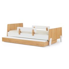 a bed that is made out of wood and white material with no sheets on it