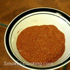 a white bowl filled with spices on top of a table