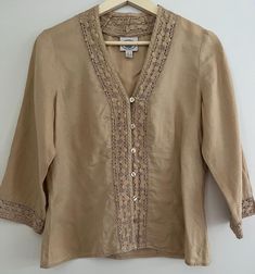 Women's vintage Laura Ashley button up blouse in tan colour Linen Cotton embroidery around edges Size 8 or small in excellent vintage condition Beige Button-up Blouse With Floral Embroidery, Beige Linen Tops With Floral Embroidery, Vintage Beige Linen Blouse, Beige Embroidered Button-up Top, Embroidered Beige Linen Top, Beige Embroidered Linen Top, Linen Button-up Top With Embroidery, Linen Embroidered Button-up Top, Embroidered Linen Button-up Top