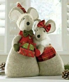 two stuffed mice sitting on top of each other