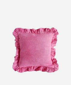 a pink pillow with ruffled edges