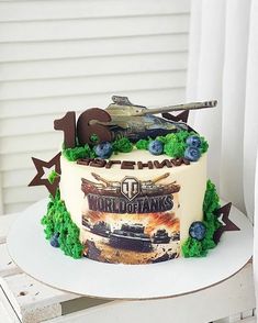 a birthday cake with an army tank on top