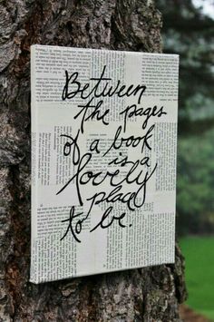 a piece of paper that has been placed on a tree with writing written on it