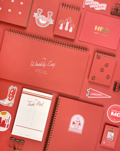 A collection of red-orange notebooks, pens, stickers, and other stationery items. Red Planner Aesthetic, Business Stationery Set, Red Notebook Cover Design, Playful Multicolor Stationery For Gifts, Cute Rectangular Multicolor Stationery, Christmas Beer, Notebook Cover Design, Letterpress Stationery, Fine Stationery