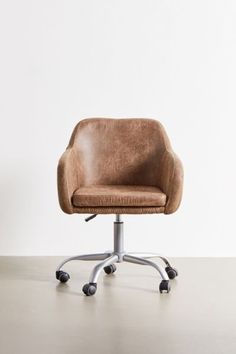 a brown office chair sitting on top of a metal base