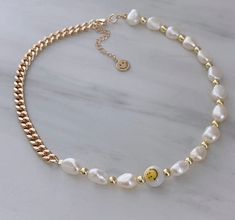 "ITEM DETAILS: * Material: 18k Gold Filled Chain Freshwater Pearl Gold Plated Beads Ceramic Smiley Face Beads Nickel Free Hypoallergenic * Size Chain: 15\" + 2\" Extension Each Necklace is Handmade 💕 If you have any suggestions, just let me know in a message and I will try to do my best according to availability at the time of order. * Shipment: Everything Is made to order. Order preparation may tak 3 To 5 business day. * Packaging: The jewels are packed and delivered in a beautiful packaging, Smiley Face Beads, Smiley Face Necklace, Horoscope Necklace, Y2k Necklace, Face Necklace, Gold Filled Necklace, Gift For Best Friend, Gold Cross Necklace, Initial Necklace Gold