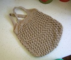 a crocheted bag sitting on top of a table