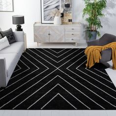 a black and white rug in a living room