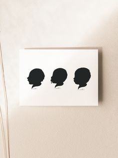 the silhouettes of three women's heads are shown on a piece of paper