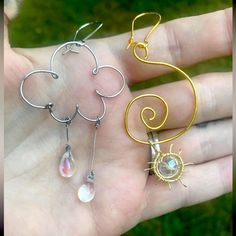 Brand New, Handmade, Women Or Junior’s Gold And Silver Wrapped Wire Dangly Earrings. Asymmetric/Miss-Matched Design. One Gold 0.8mm 20g Wire Swirl And Sun Earring With 8-10mm Faceted Clear Rondelle Bead. One Silver 0.8mm Wire Wrapped Cloud With Dangly Rain Drop Beads, Clear Iridescent 6x8mm. With Earring Hooks. Approx Measurements Seen Photographed Offers Welcome!! Bundle 2+ For Discount And Save $$$ Sun Earring, Wire Beads, Wire Hoop Earrings, Sun And Rain, Rain Cloud, Rain Clouds, Drop Beads, Dangly Earrings, Earring Hooks