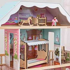 a doll house with furniture and accessories inside