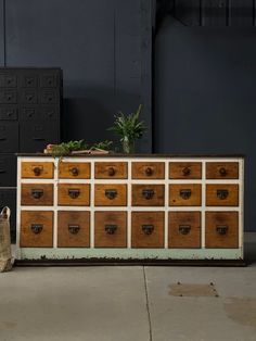 an old dresser with many drawers on it