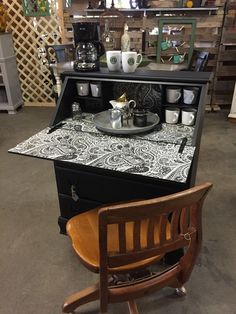 a black and white counter top sitting next to a wooden chair