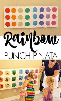 two girls are standing in front of a wall with rainbows painted on it and the words, rainbow punch pinata