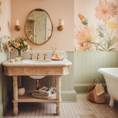 a bathroom with a sink, mirror and bathtub in the corner is decorated with flowers