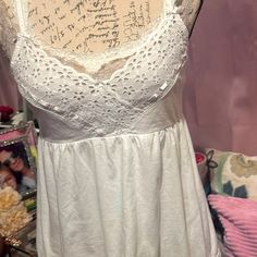 Very Cute Looks Brand New Feminine Cotton Camisole For Vacation, Feminine Cotton Camisole For Beach, White Feminine Tank Top For Loungewear, Feminine Cotton Camisole For Day Out, Vacation Cotton Tank Top With Lace Trim, Cotton Tank Top With Lace Trim For Day Out, Cotton Lace Trim Tank Top For Vacation, Victoria's Secret Spring Camisole With Built-in Bra, Victoria's Secret Casual Summer Tank Top