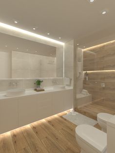 a modern bathroom with wooden flooring and white fixtures on the walls, along with two sinks