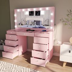 a pink vanity table with drawers and lights