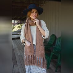 Cozy up in our oversized Kolbie Knitted Pocket Scarf, wrap two or three times for a Fall accessorized finish. It'll be your go - to on a Winter day because it features: Cozy, chunky, soft yarns Oversized Pocket details Fringe bottom ends *Due to lighting and differences in monitors, actual colors may vary slightly from what appears online. Model is 5'8" and wearing a size OS. Approximate measurements are as follows: OS: 110 "x 13" MEDIUM: Bust: ", Waist: ", Hip: , Length: ", Sleeve length: " LARGE: Bust: ", Waist: ", Hip: , Length: ", Sleeve length: " X - LARGE: Bust: ", Waist: ", Hip: , Length: ", Sleeve length: " 100% Acrylic Hand wash cold, Lay flat to dry Import | Kolby Knitted Pocket Scarf Boho Essentials, Pocket Scarf, Pocket Scarves, Bralette Outfit, Fall Collections, Soft Yarn, Winter Day, New Tops, Large Bust