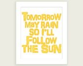 the words tomorrow may rain, so i'll follow the sun on white paper