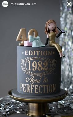 a birthday cake with an image of a woman sitting on top of it and the number forty