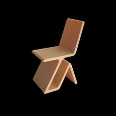 a wooden chair sitting on top of a black background