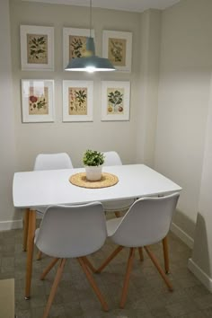 a white table with four chairs around it