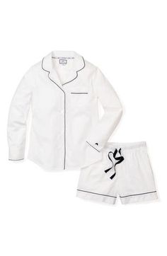 This refined pajama set is polished off with smooth contrast piping, elegantly curved lapels and a chest patch pocket. Top has curved lapels; long sleeves 100% cotton Machine wash, dry flat Imported White Classic Sleepwear For Spring, Classic White Sleepwear For Pajama Party, Classic White Relaxed Fit Sleepwear, Classic White Long Sleeve Sleepwear, Classic Long Sleeve Pajama Party Sets, Classic Fitted Sleepwear For Loungewear, Navy Blue Pajamas, Luxury Sleepwear, Classic Pajamas