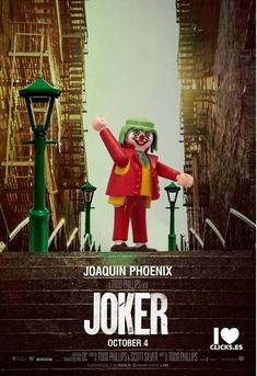 the joker movie poster is displayed in front of some stairs and street lights, with a person dressed as a clown